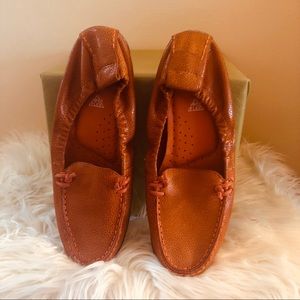 Orange Hush Puppy loafers